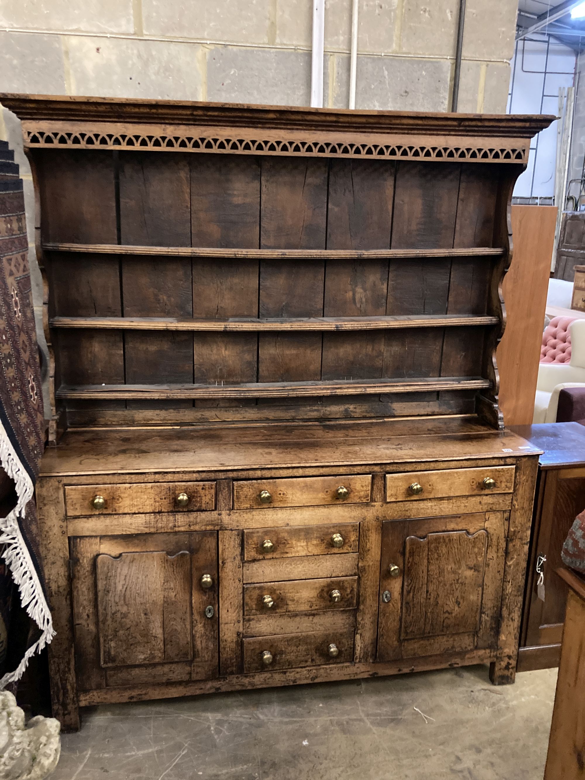 A George III oak dresser, width 170cm, depth 52cm, height 208cm